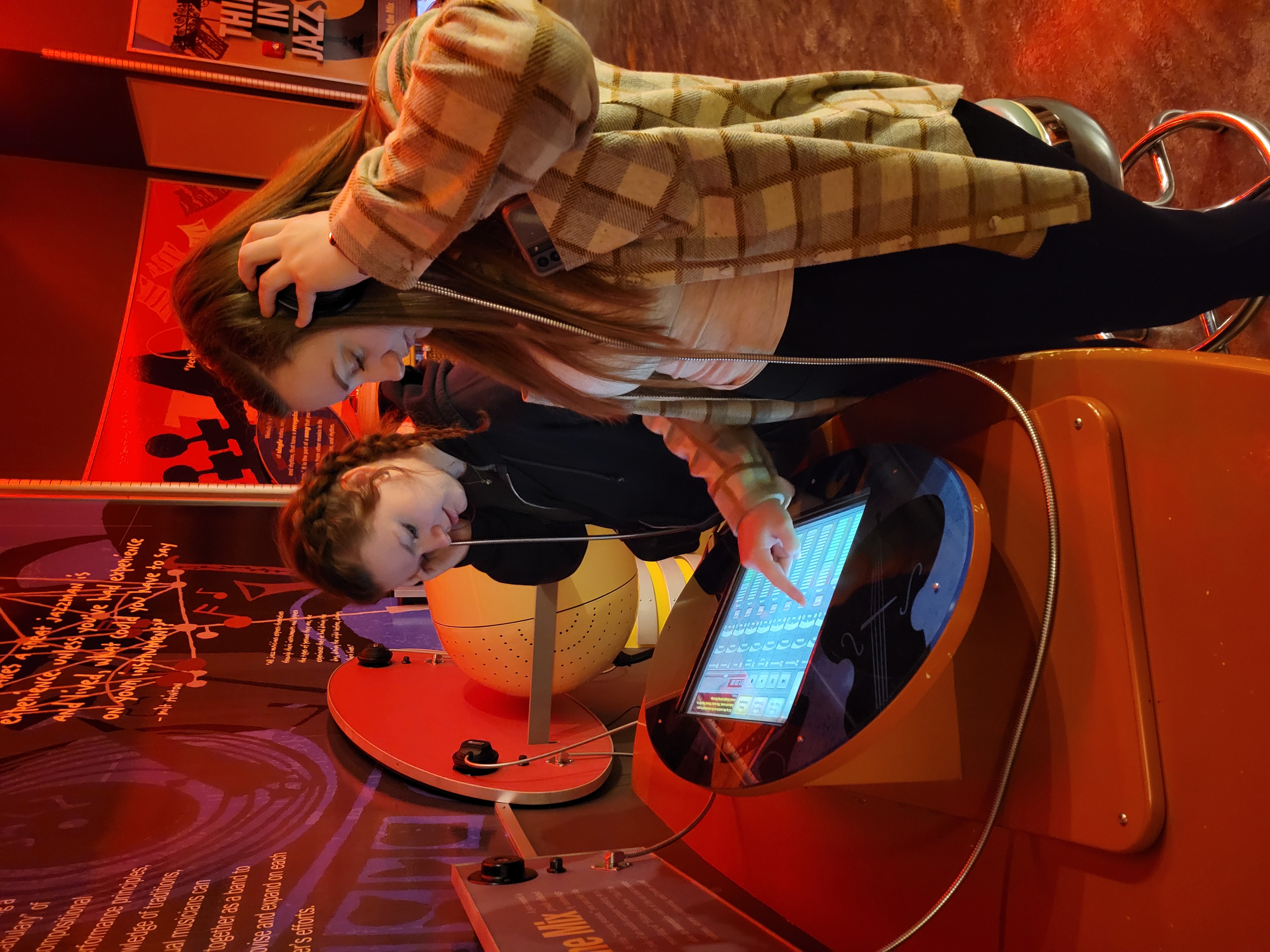 Two jazz students at a learning station at the American Jazz Museum