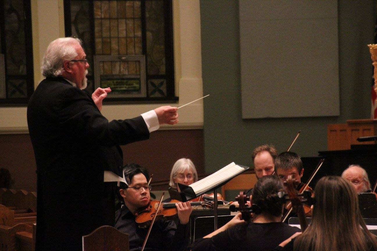 The Southwest Minnesota Orchestra is performing under the direction of Dr. Daniel Rieppel in the sanctuary of Holy Redeemer Church in Marshall, Minnesota.