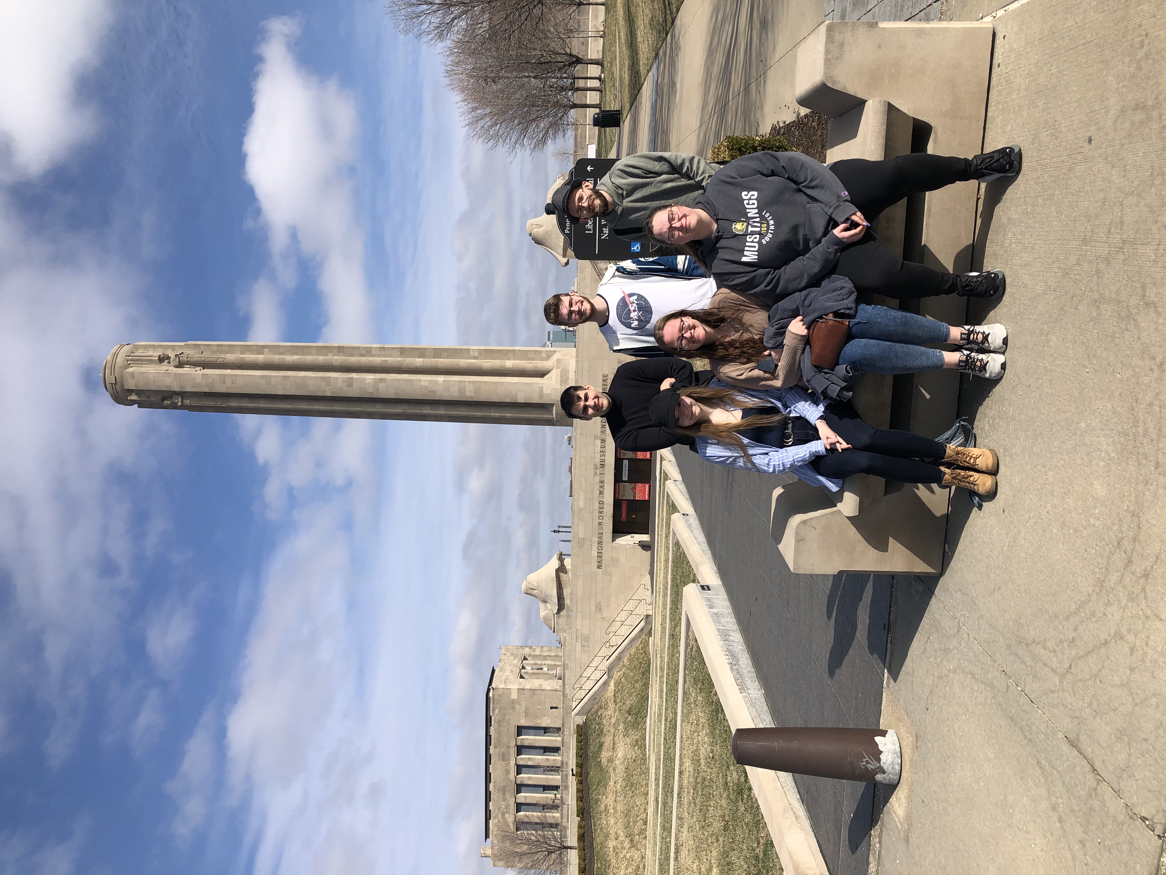 Some jazz ensemble members posing outside the World War 1 Museum in Kansas City, Missouri.