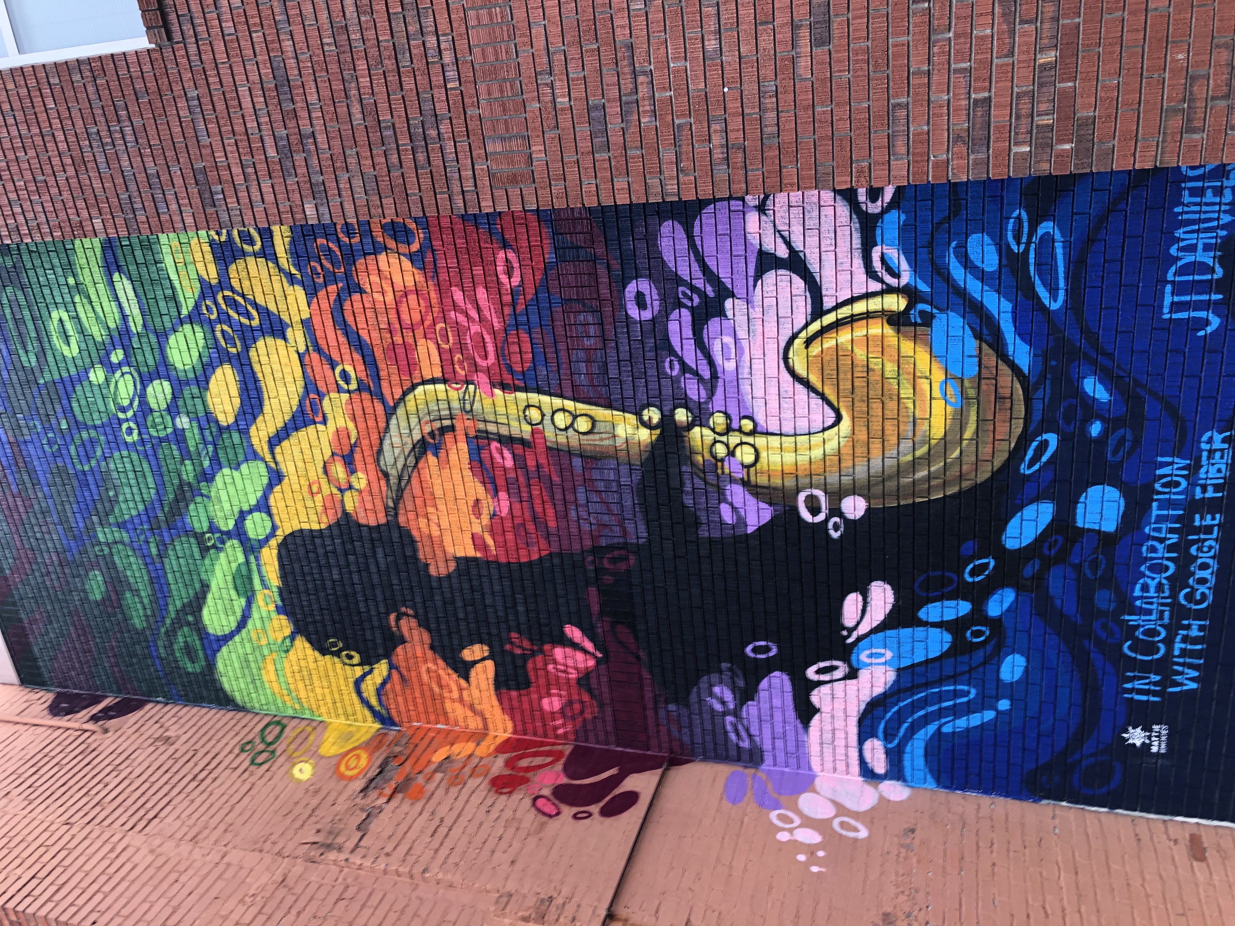 street image from18th and Vine in Kansas City. A painting of a saxophonist.