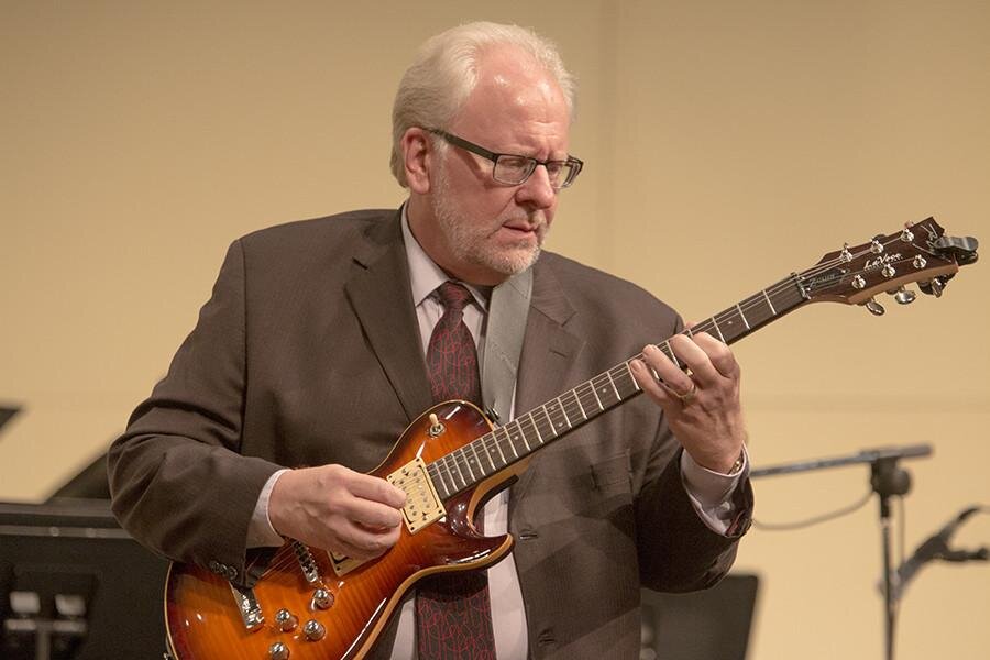 picture of guest guitarist, Mike Dana, playing the guitar