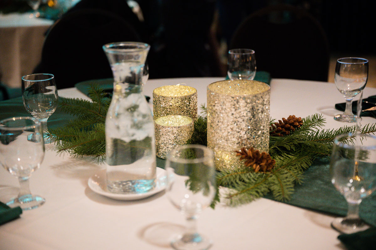 winter centerpiece with candles and pine cones