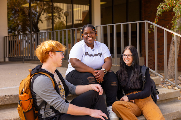 students talking outside