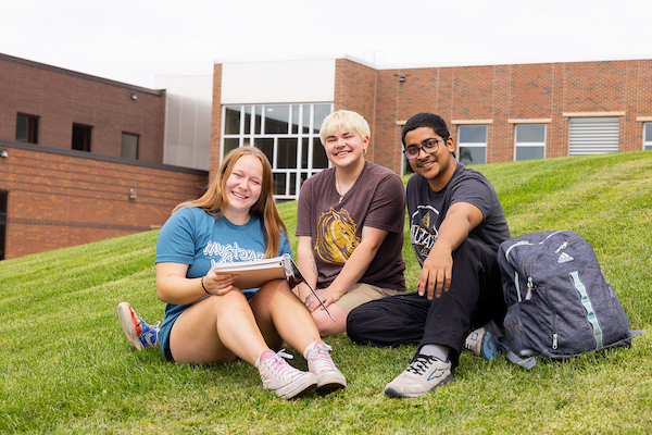 students studying outside in summer