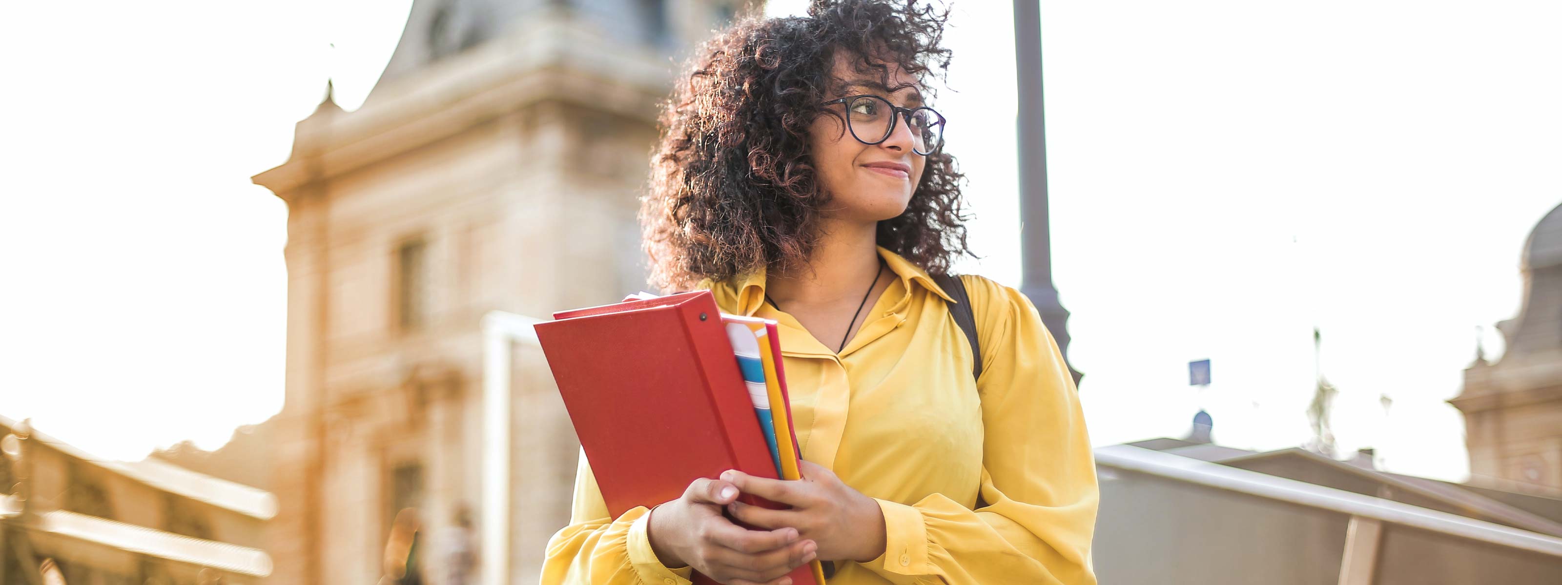 Woman holding notebooks