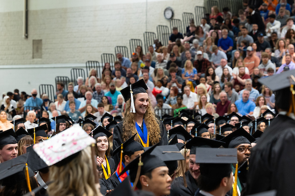Brenna Springborg, center, stands as her name was announced at commencement.