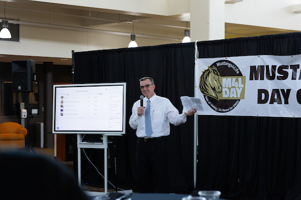 Justin Vorbach, Director of Annual Giving, speaking at the M4L Day Celebration